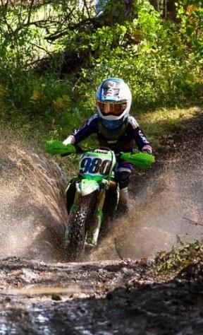 Tucker Aldrich #980 splashing through a wet woods section